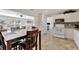 Open kitchen with white cabinetry, modern appliances, and seamless flow to the dining and living areas at 2916 Woodcrest Dr, Sarasota, FL 34239