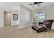 Relaxing living room featuring a comfortable leather chair and ottoman, complemented by stylish flooring and natural light at 2916 Woodcrest Dr, Sarasota, FL 34239