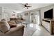 Bright living room featuring a comfortable sofa, modern furnishings and French doors to the exterior at 2916 Woodcrest Dr, Sarasota, FL 34239