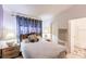 Comfortable bedroom with large bed and decorative lamps at 323 Bobby Jones Rd # 323, Sarasota, FL 34232