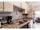 Bright kitchen featuring stainless sink, marble counters and modern lighting at 323 Bobby Jones Rd # 323, Sarasota, FL 34232