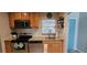Functional kitchen boasts granite countertops, modern appliances, and ample natural light at 3390 Ramblewood Ct, Sarasota, FL 34237