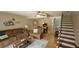 Cozy living room with staircase, tile flooring, and dining area nearby at 3390 Ramblewood Ct, Sarasota, FL 34237