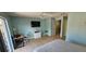 Comfortable main bedroom with a ceiling fan, closet, and plenty of space at 3390 Ramblewood Ct, Sarasota, FL 34237