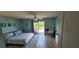 Spacious main bedroom with ceiling fan, ensuite access, and private balcony at 3390 Ramblewood Ct, Sarasota, FL 34237