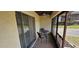 Relaxing screened patio featuring seating and views of the landscaped outdoors at 3390 Ramblewood Ct, Sarasota, FL 34237
