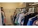 Spacious walk-in closet with extensive shelving and hanging space for clothes and storage at 3390 Ramblewood Ct, Sarasota, FL 34237