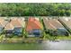 Waterfront property showcasing a screened-in lanai with a pool and access to the lake, ideal for outdoor living at 344 Maraviya Blvd, Nokomis, FL 34275