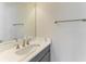 Modern bathroom featuring a marble countertop, oval sink, and brushed nickel faucet at 344 Maraviya Blvd, Nokomis, FL 34275