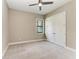 Cozy bedroom with neutral walls, plush carpet, and ample closet space provides comfort and style at 344 Maraviya Blvd, Nokomis, FL 34275