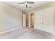 Bedroom with neutral carpet, ceiling fan, closet, and ensuite access at 344 Maraviya Blvd, Nokomis, FL 34275