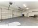 Expansive garage with overhead storage, perfect for vehicles and projects at 344 Maraviya Blvd, Nokomis, FL 34275