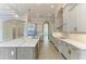 Bright and spacious kitchen with stainless steel appliances, large island, and open layout at 344 Maraviya Blvd, Nokomis, FL 34275