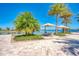 Picturesque lakeside seating area with comfortable chairs and umbrellas, offering a tranquil outdoor escape at 344 Maraviya Blvd, Nokomis, FL 34275