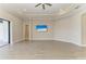 Bright living room features recessed lights, ceiling fan, beach themed TV, and open layout with light tile floor at 344 Maraviya Blvd, Nokomis, FL 34275