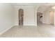 Open floor plan with tile floors, arched doorways, and views through to the kitchen and other living spaces at 344 Maraviya Blvd, Nokomis, FL 34275