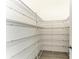 Walk-in pantry with wire shelving offers ample storage space, keeping your kitchen organized and clutter-free at 344 Maraviya Blvd, Nokomis, FL 34275
