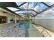 Relax by the pool and spa with a full outdoor kitchen, all within a screened lanai offering scenic lake views at 344 Maraviya Blvd, Nokomis, FL 34275
