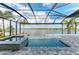 Enjoy the screened-in pool with spa and beautiful views of the lake, creating a perfect outdoor oasis at 344 Maraviya Blvd, Nokomis, FL 34275