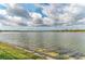 Scenic view of the tranquil lake, showcasing the property's prime waterfront location and serene surroundings at 344 Maraviya Blvd, Nokomis, FL 34275