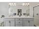 Bathroom featuring double sinks and a glass shower at 3736 82Nd Avenue E Cir # 104, Sarasota, FL 34243