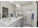 Bathroom with double sink vanity and large glass shower at 3736 82Nd Avenue E Cir # 104, Sarasota, FL 34243