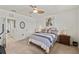 Bedroom with ceiling fan and zebra art on the wall at 3736 82Nd Avenue E Cir # 104, Sarasota, FL 34243