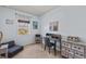 Bedroom featuring a desk and chair, a futon couch, and a picturesque window with lovely natural light at 3736 82Nd Avenue E Cir # 104, Sarasota, FL 34243