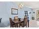 Stylish dining area featuring modern light fixture and tasteful decor at 3736 82Nd Avenue E Cir # 104, Sarasota, FL 34243