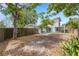 Expansive backyard featuring a patio, privacy fence and mature trees at 3857 Woodrow Ridge St, Sarasota, FL 34233