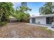 Spacious backyard featuring a small patio with seating area at 3857 Woodrow Ridge St, Sarasota, FL 34233