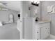 Bright bathroom features a granite countertop, sleek black faucet and decorative light fixture at 3857 Woodrow Ridge St, Sarasota, FL 34233
