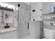Modern bathroom featuring glass enclosed shower with marble tile and granite vanity at 3857 Woodrow Ridge St, Sarasota, FL 34233