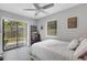 Bedroom with sliding glass doors opening to the outside, letting in natural light at 3857 Woodrow Ridge St, Sarasota, FL 34233