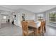 Inviting dining room flows seamlessly into the kitchen with plentiful natural light and modern flooring at 3857 Woodrow Ridge St, Sarasota, FL 34233