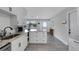 Well-appointed kitchen featuring white cabinets, granite countertops, modern appliances, and ample storage space at 3857 Woodrow Ridge St, Sarasota, FL 34233