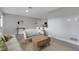 Bright living room showcasing modern furniture, light gray walls, contemporary decor, and an open layout at 3857 Woodrow Ridge St, Sarasota, FL 34233