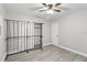 A bright bedroom with neutral walls, updated flooring, and ample closet space at 4111 Rockefeller Ave, Sarasota, FL 34231