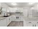 Modern kitchen featuring white cabinetry, sleek countertops, and stainless steel appliances at 4111 Rockefeller Ave, Sarasota, FL 34231