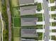 Aerial view of the property showing roof, driveway, and landscaping; community neighborhood at 4240 Pond Brook Ct, Bradenton, FL 34211