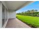 Enjoy the outdoors on this covered patio with a brick floor and expansive backyard views at 4240 Pond Brook Ct, Bradenton, FL 34211
