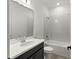 Well-lit bathroom featuring a vanity and a shower-over-tub combo with a white tile surround at 4240 Pond Brook Ct, Bradenton, FL 34211