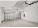 Spacious two-car garage with an automatic door and concrete floor, ready for vehicles and storage at 4240 Pond Brook Ct, Bradenton, FL 34211