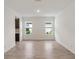 Bright and inviting living area with lots of natural light, adjacent to kitchen area at 4240 Pond Brook Ct, Bradenton, FL 34211