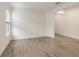 Versatile living space with wood-look tile flooring and bright light, ideal for a home office or den at 4240 Pond Brook Ct, Bradenton, FL 34211