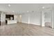 Bright and open living area with wood-look tile flooring, adjacent to the kitchen, ideal for entertaining at 4240 Pond Brook Ct, Bradenton, FL 34211