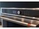 Close-up of a stainless steel oven control panel, showing digital display and various cooking settings at 4240 Pond Brook Ct, Bradenton, FL 34211