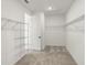 Walk-in closet provides lots of storage with metal shelving, next to the bedroom at 4240 Pond Brook Ct, Bradenton, FL 34211