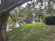 Picturesque backyard pond view showcases lush greenery at 4538 Hamlets Grove Dr, Sarasota, FL 34235