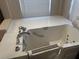 Close-up of walk-in bathtub with hydrotherapy jets and easy access features for comfortable bathing at 4538 Hamlets Grove Dr, Sarasota, FL 34235